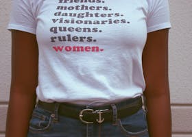 Close-up of a t-shirt celebrating women's roles and empowerment.